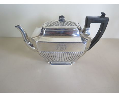 A Victorian silver teapot with ebony handle and finial, engraved with a monogram, possibly R W M, approximately 21.8 toz, sig