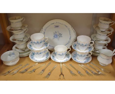 A Paragon Morning Rose pattern tea service for six comprising bread and butter plate, side plates, sugar bowl, creamer, cups 