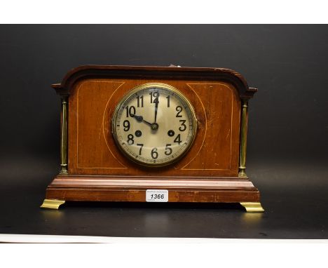 An inlaid mahogany mantel clock, brass mounted