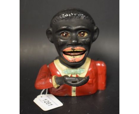 A Beacon Products cast iron Jolly N****r money bank