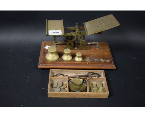 A late 19th century postage scale with weights;  another (2)