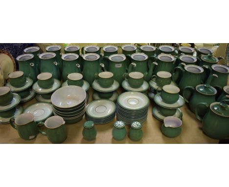 An extensive Denby Pottery Green pottery table service, comprising coffee pots, tea pots, cups, saucers, cereal bowls; etc.