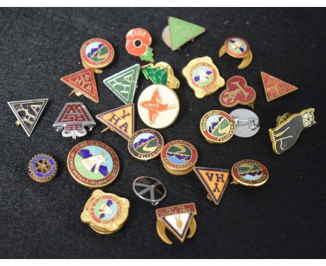 A collection of enamel badges