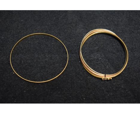 A 9ct gold three colour bracelet;  a 9ct gold slave bangle, 12.6g gross (2)