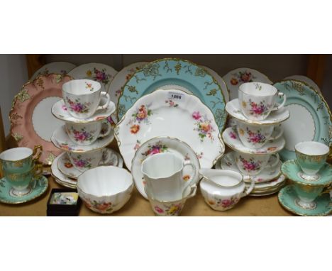 A Royal Crown Derby Posie pattern tea set, comprising six cups, saucers, tea plates, side plates, milk and sugar, bread and b