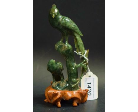 Chinese jade birds, perched on a tree, wooden base
