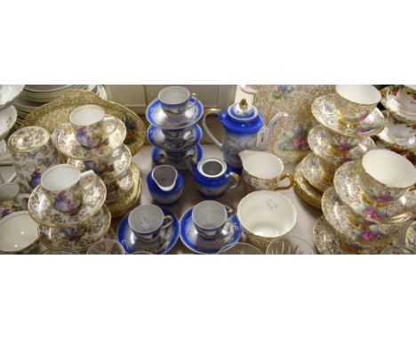 A Staffordshire crinoline lady tea service for six comprising bread and butter plate, side plates, sugar bowl, cream jug, cup