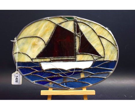An Art Deco stained glass oval panel, yachting scene