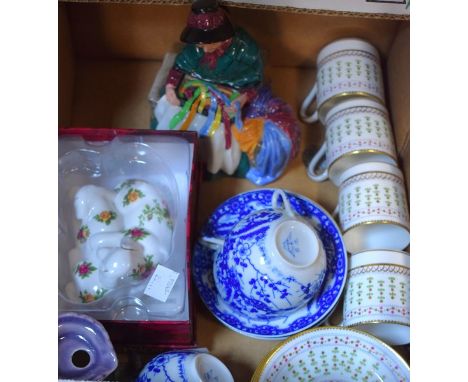 A Doulton figure, Silks and Ribbons; Royal Albert dogs; a set of four coffee cans and saucers; etc.