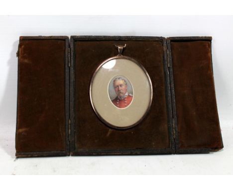 A 19th century ivory portrait miniature depicting an elderly gentleman in military dress, in rose metal mount, 4 x 3cm, in fi