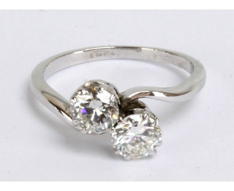 A platinum and diamond two stone crossover diamond ring, each stone weighing approx 0.5ct, in claw setting, size E1/2, approx