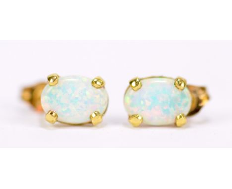 A pair of 9ct yellow gold and opal ear studs, approx 0.5g.