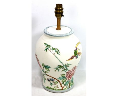 A ceramic cream ground lamp base with painted floral and exotic bird decoration attributed to Charlotte Rhead for Wood &amp; 