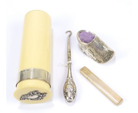 CE WILLIAMS; an Edward VII hallmarked silver mounted celluloid dressing table jar, Birmingham 1902, height 11cm, a clog shape