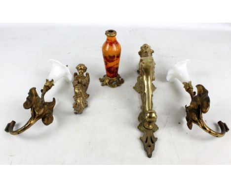 A large brass door handle decorated with dragon's head and foliate scrolls, height 40cm, also two floral ornaments, a cherubi