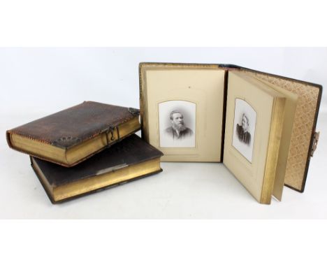 Three Victorian leather bound photograph albums, all containing various family group and portrait photos (3).