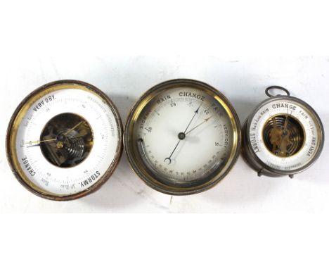 A brass cased barometer and thermometer, diameter 12.5cm, a holosteric circular barometer, diameter 13.5cm, and a small anero