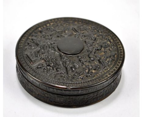 A mid-19th century Chinese Canton pressed horn snuff box of circular form, with overall decorated figures in landscapes, diam