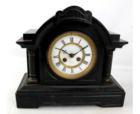 A late 19th century French black slate mausoleum mantel clock with two-piece white enamel dial inscribed 'Russells Ltd Paris'