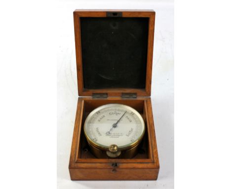 An oak cased brass circular barometer with silvered dial inscribed 'Callaghan &amp; Co, 23A New Bond St, Corner of Conduit St