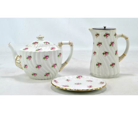 WILEMAN &amp; CO; a Foley semi-porcelain wrythen moulded teapot and stand with matching jug with correct pewter lid, all piec