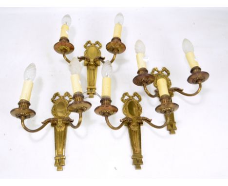 A set of four 20th century brass Neo-Classical style twin branch wall mounted light fittings, each length 25.5cm (4). 