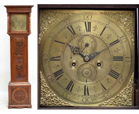 A 19th century oak longcase clock, the moulded floral decorated cornice above a 12" square brass dial set with subsidiary sec