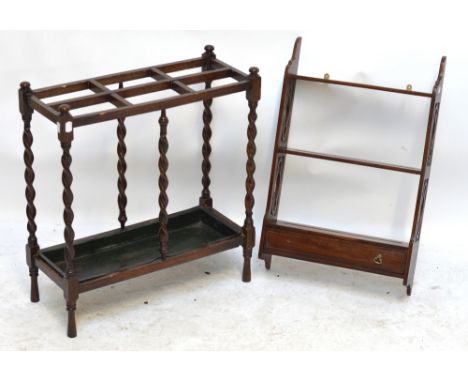 An early 20th century oak six division stick stand and a mahogany wall shelf (2).