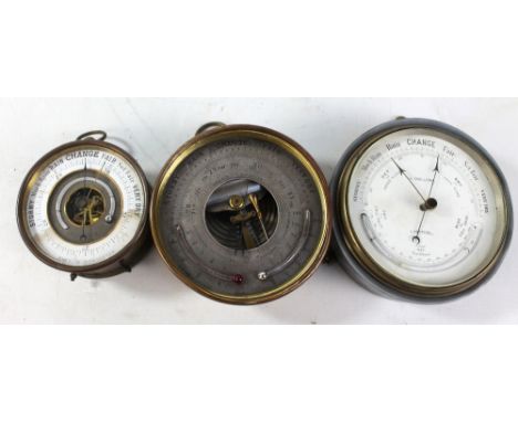 A brass cased circular aneroid barometer, diameter 10.5cm, a further brass cased barometer with thermometers, diameter 13.5cm