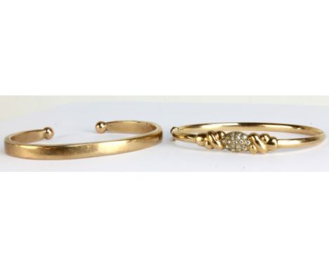 A 9ct yellow gold torque bangle and a 9ct yellow gold hinged snap bangle, combined approx 38g (2). CONDITION REPORT: Hinged b