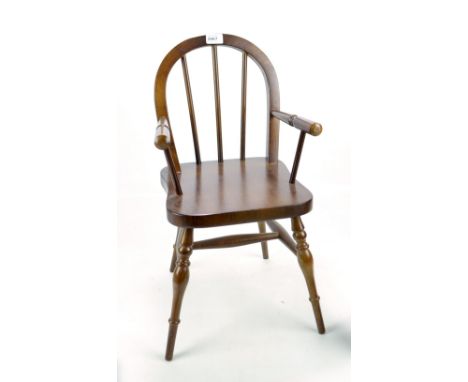 A child's comb back elbow chair.