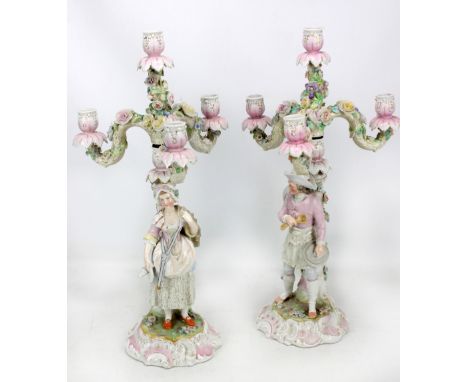 A pair of late 19th/early 20th century Meissen porcelain candelabra with three S-scroll branches and central light with overa