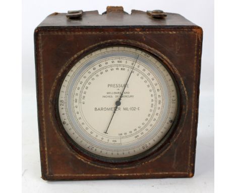 A leather cased circular barometer, model ML-102-E, height of case 19cm.