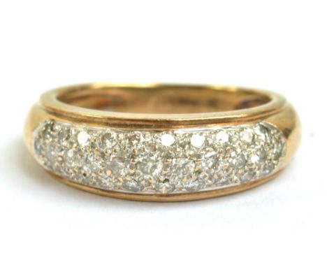 A yellow metal diamond set domed half eternity ring, size J, approx 4.6g.