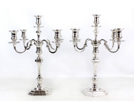 THOMAS BRADBURY &amp; SONS LTD; a pair of George V hallmarked silver five light candelabra with campana shaped sconces and fo