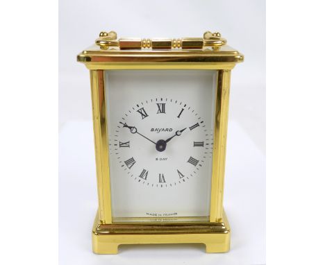 A 20th century brass eight day carriage clock, the white enamel dial inscribed 'Bayard, Eight Day, Made in France', the movem