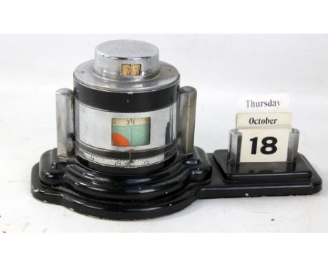 An Art Deco black painted and chrome perpetual calendar/barometer, length 26cm.