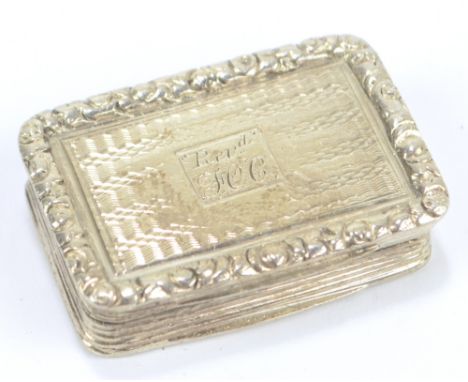 THOMAS SHAW; a Victorian hallmarked silver vinaigrette of rectangular form with engine turned decorated base and hinged lid c