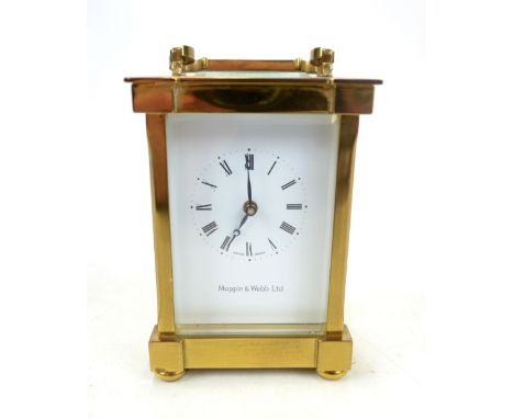 MATTHEW NORMAN; a brass cased carriage clock, the white enamel dial set with Roman numerals inscribed 'Mappin &amp; Webb Ltd'