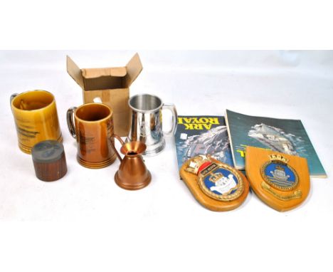 HMS ARK ROYAL; two wall mounted plaques, two ceramic mugs, a pewter example, a copper jug and two books (8).