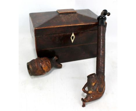 A Tyrolean carved wooden pipe, length 25cm, and a 19th century burr yew tea caddy (both af) (2). CONDITION REPORT: The pipe w