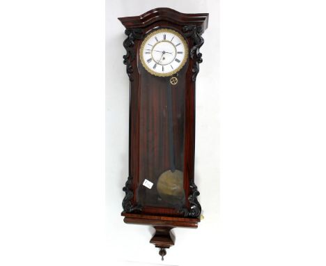 A late 19th century rosewood and simulated rosewood single weight Vienna style wall clock, the two-piece white enamel dial se