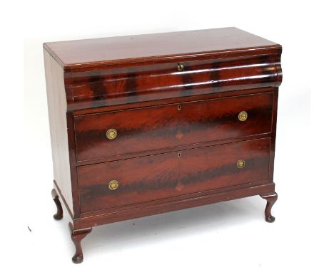 A 19th century Continental mahogany three drawer commode with later top, shaped top drawer, two further drawers and later cab