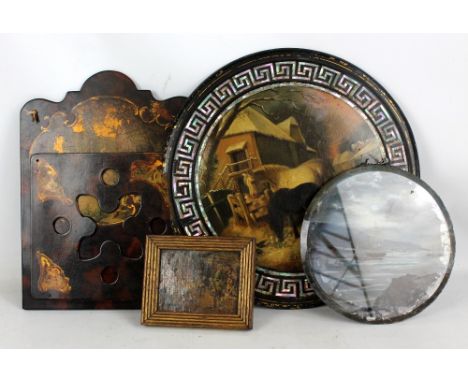 A Victorian ebonised and mother of pearl inlaid circular panel, painted with winter stable scene, diameter 43.5cm (af), a tra