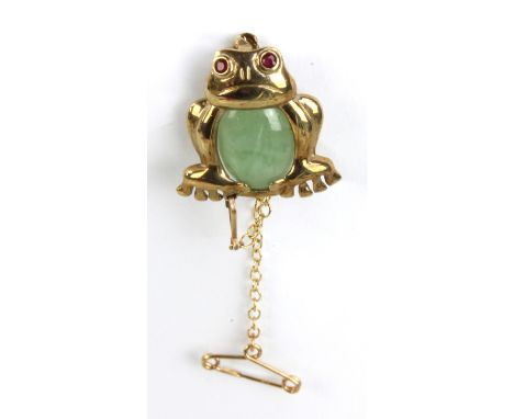 A 9ct yellow gold novelty brooch modelled as a frog with gem set eyes and jade coloured plaque for a stomach, height approx 2
