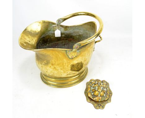 A brass coal scuttle and a reproduction lion mask door knocker (2).