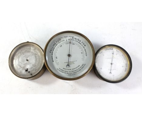 A Hutchinsons Testing Apparatus Ltd of Westminster weather indicator, diameter 13cm, a brass circular barometer inscribed 'Wa