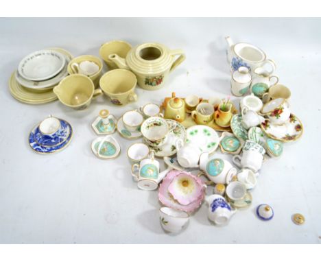 A collection of various ceramic miniature tea sets including Spode, Wedgwood blue jasperware and WH Goss, also Wedgwood 'Pete