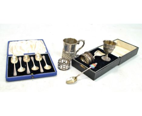 A small group of variously hallmarked silver items comprising a christening cup, J Sherwood &amp; Sons, Birmingham 1864, a se