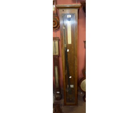 A late 19th/early 20th century oak and glazed cased marine type stick barometer with silvered upper section inscribed 'Casell